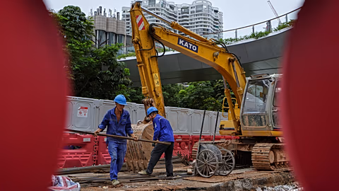 Werknemers op een bouwplaats in het commerciële district Shenzhen Bay, in Shenzhen, provincie Guangdong, China. 19 sep. 2025.